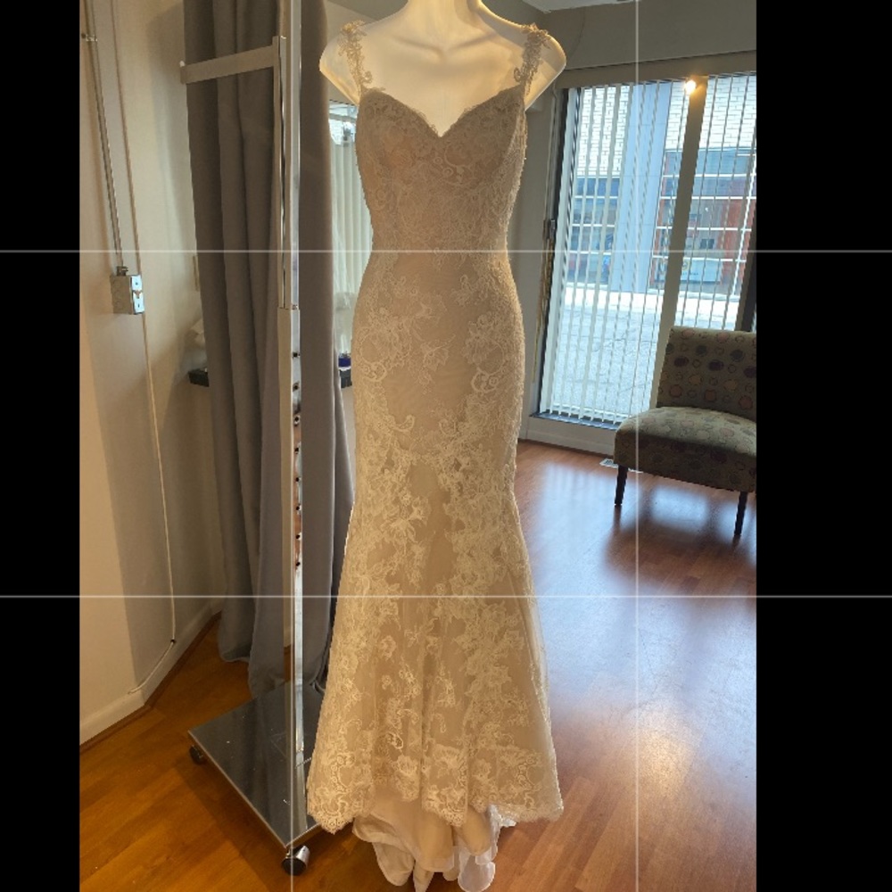 All over lace bridal gown with lace straps.